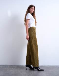 Model wearing Barrel high rise jean in honey cord