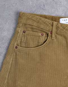 Model wearing Barrel high rise jean in honey cord