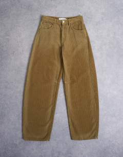 Model wearing Barrel high rise jean in honey cord