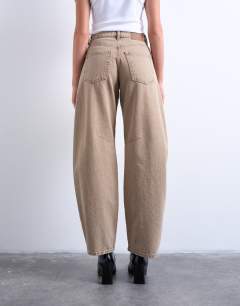 Model wearing Barrel high rise jeans in washed beige