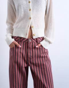 Model wearing Barrel jean in red and pink