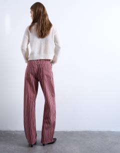 Model wearing Barrel jean in red and pink
