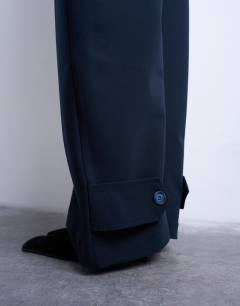 Model wearing Barrel leg tailored trousers in navy