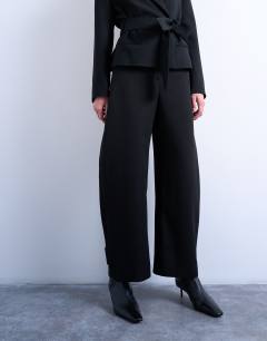Model wearing Barrel leg trouser in black