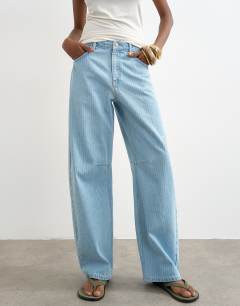 Model wearing Barrel mid rise jean in bleach pinstripe