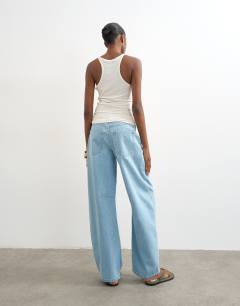 Model wearing Barrel mid rise jean in bleach pinstripe