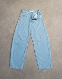 Model wearing Barrel mid rise jean in bleach pinstripe