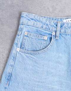 Model wearing Barrel mid rise jean in bleach