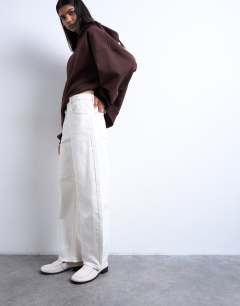 Model wearing Barrel mid rise jean in bone