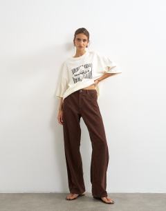 Model wearing Barrel mid rise jean in chocolate cord