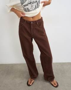 Model wearing Barrel mid rise jean in chocolate cord