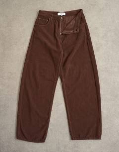 Model wearing Barrel mid rise jean in chocolate cord
