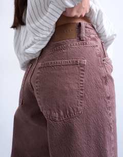 Model wearing Barrel mid rise jean in eggplant