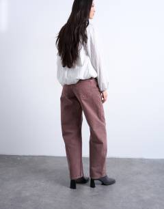 Model wearing Barrel mid rise jean in eggplant
