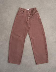 Model wearing Barrel mid rise jean in eggplant