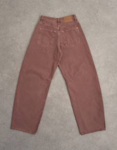 Model wearing Barrel mid rise jean in eggplant