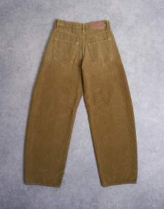 Model wearing Barrel mid rise jean in honey cord