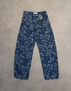 Model wearing Barrel mid rise jean in jacquard floral