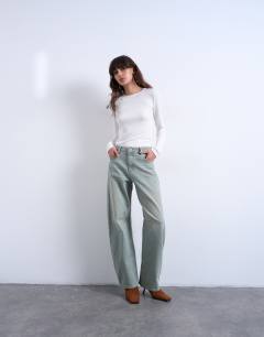 Model wearing Barrel mid rise jean in mint green