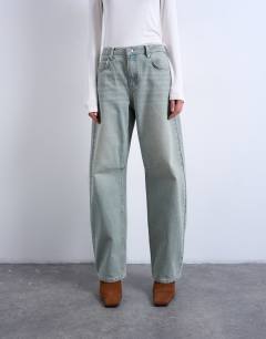 Model wearing Barrel mid rise jean in mint green