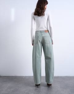 Model wearing Barrel mid rise jean in mint green