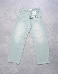 Model wearing Barrel mid rise jean in mint green