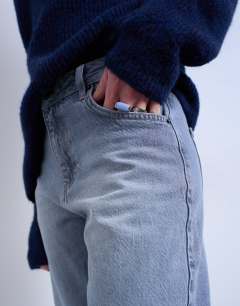 Model wearing Barrel mid rise jean in pretty grey