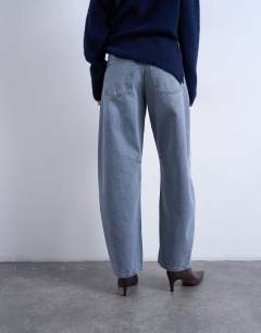 Model wearing Barrel mid rise jean in pretty grey