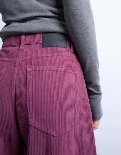 Model wearing Barrel mid rise jean in purple cord