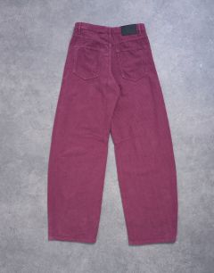 Model wearing Barrel mid rise jean in purple cord