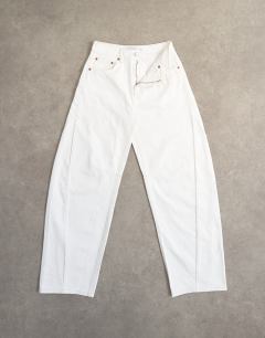 Model wearing Barrel mid rise jean in white