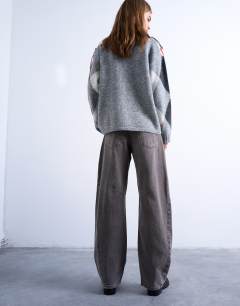 Model wearing Barrel mid rise jean with seam detail in otter