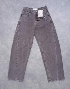 Model wearing Barrel mid rise jean with seam detail in otter