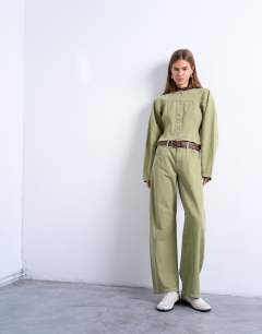 Model wearing Barrel mid rise jean with seam details in avocado