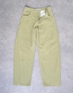 Model wearing Barrel mid rise jean with seam details in avocado