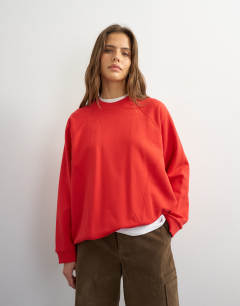 Model wearing Batwing skater sweat in red