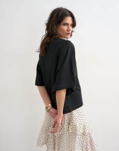 Model wearing Batwing t-shirt in black