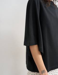 Model wearing Batwing t-shirt in black