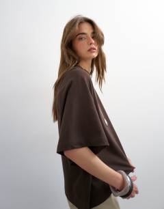 Model wearing Batwing t-shirt in dark chocolate