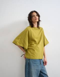 Model wearing Batwing t-shirt in green