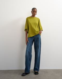 Model wearing Batwing t-shirt in green