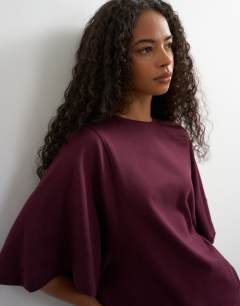 Model wearing Batwing t-shirt in plum