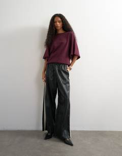 Model wearing Batwing t-shirt in plum