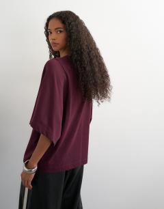 Model wearing Batwing t-shirt in plum