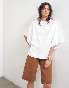 Model wearing Batwing t-shirt in white
