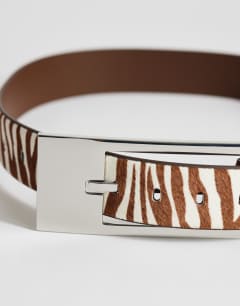 Model wearing Bea hair on real leather wide belt in brown zebra