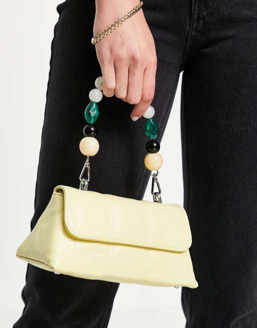 beaded handle grab clutch bag in yellow ASOS