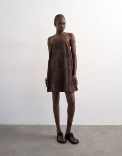 Model wearing Beaded strap trapeze mini dress with 3D cording in brown