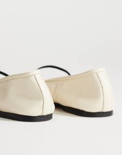 Model wearing Bella leather round toe ballet flat in off white