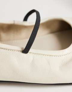 Model wearing Bella leather round toe ballet flat in off white